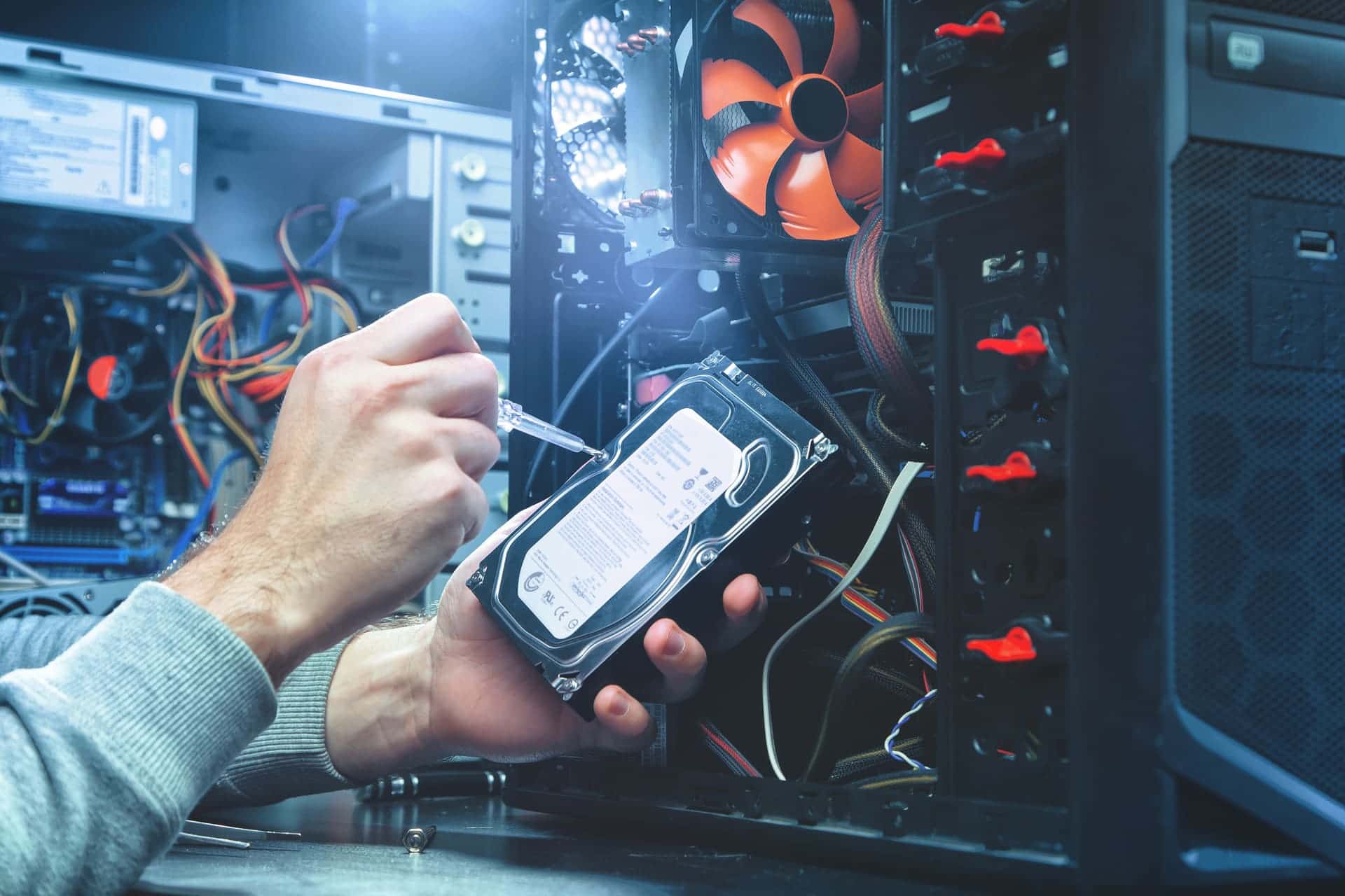 Hard drive being installed in a desktop tower